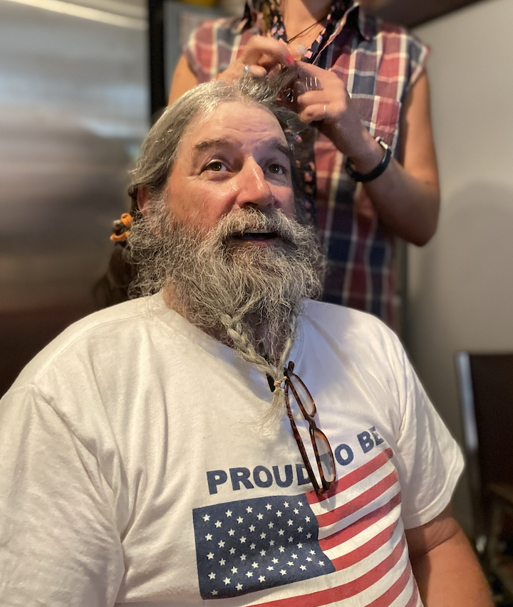 Whitewater rafting guide and all things Wyoming River Trips enthusiast getting a river guide hairstyle special for the 4th of July in Cody Wyoming